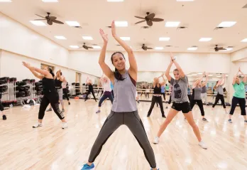 members taking cardio dance class