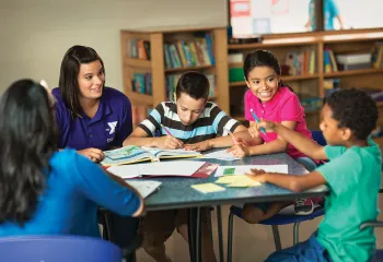 group of children reading at the library