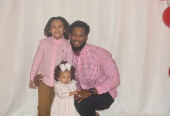 Dad with daughters at a dance