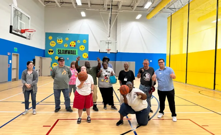 group of individuals with disabilities playing basketball