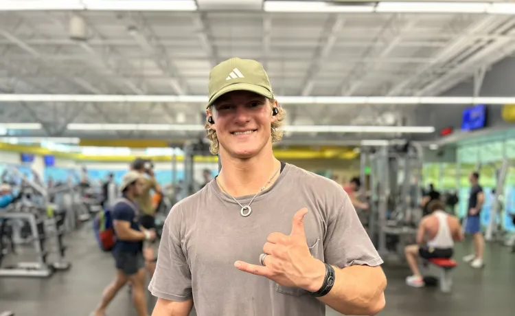 Featured member John smiles for a photo taken on the fitness floor at the Bear Levin Studer YMCA.