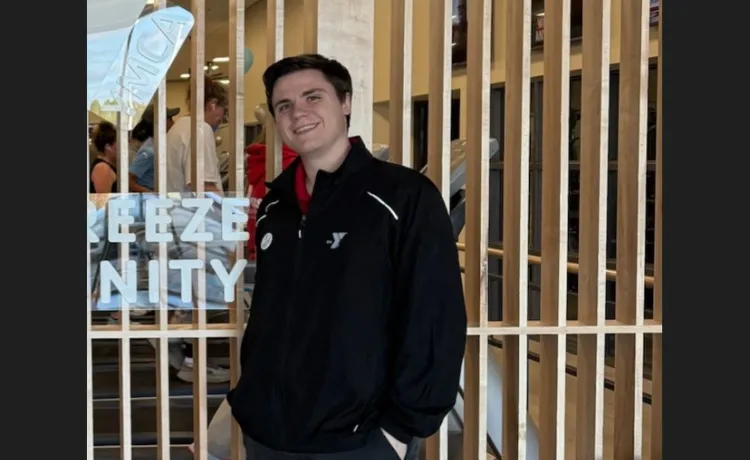 Hunter smiles for a photo in the lobby at the renovated Community YMCA at Gulf Breeze.